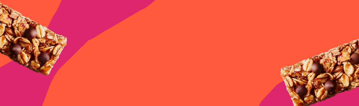Two MadeGood Chocolate Chip granola bars on a vibrant orange and pink abstract background