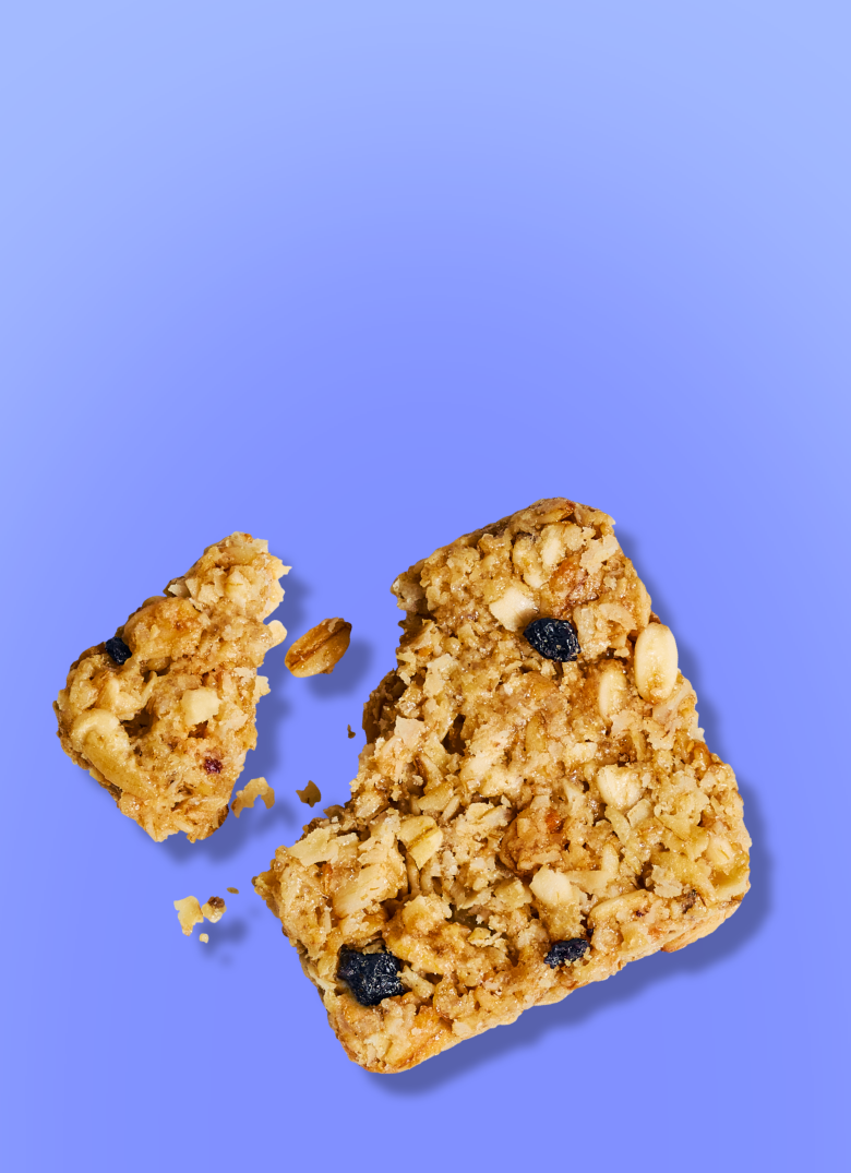 Blue background with a crunchy granola square with blueberries